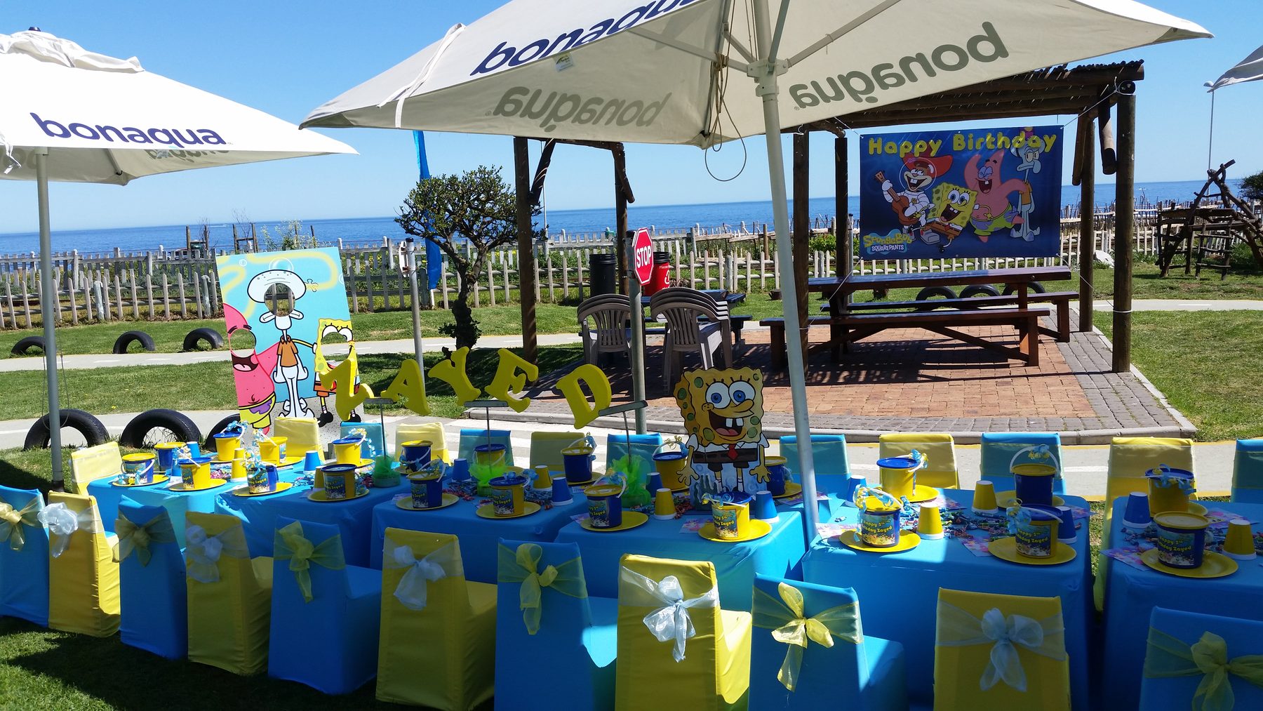 Blue and yellow Minions style kids party table setup