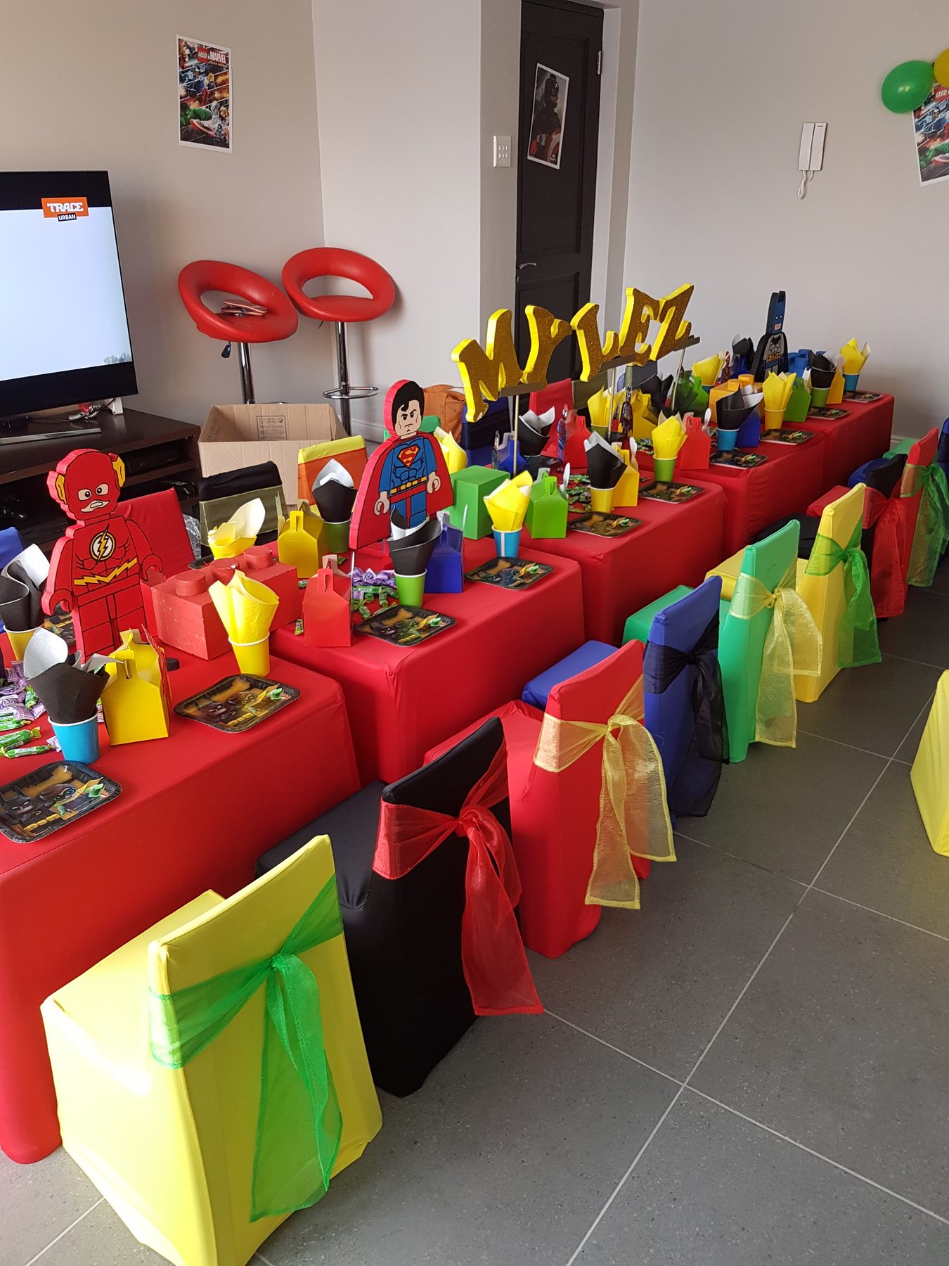 Red and yellow character party table setup