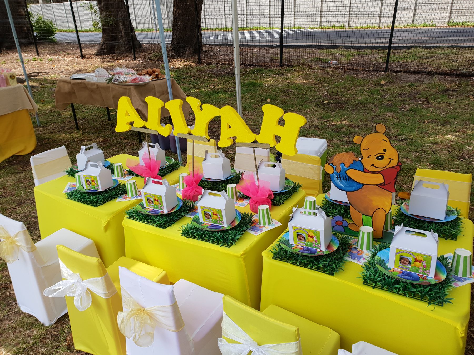 Yellow Winnie the Pooh style party setup