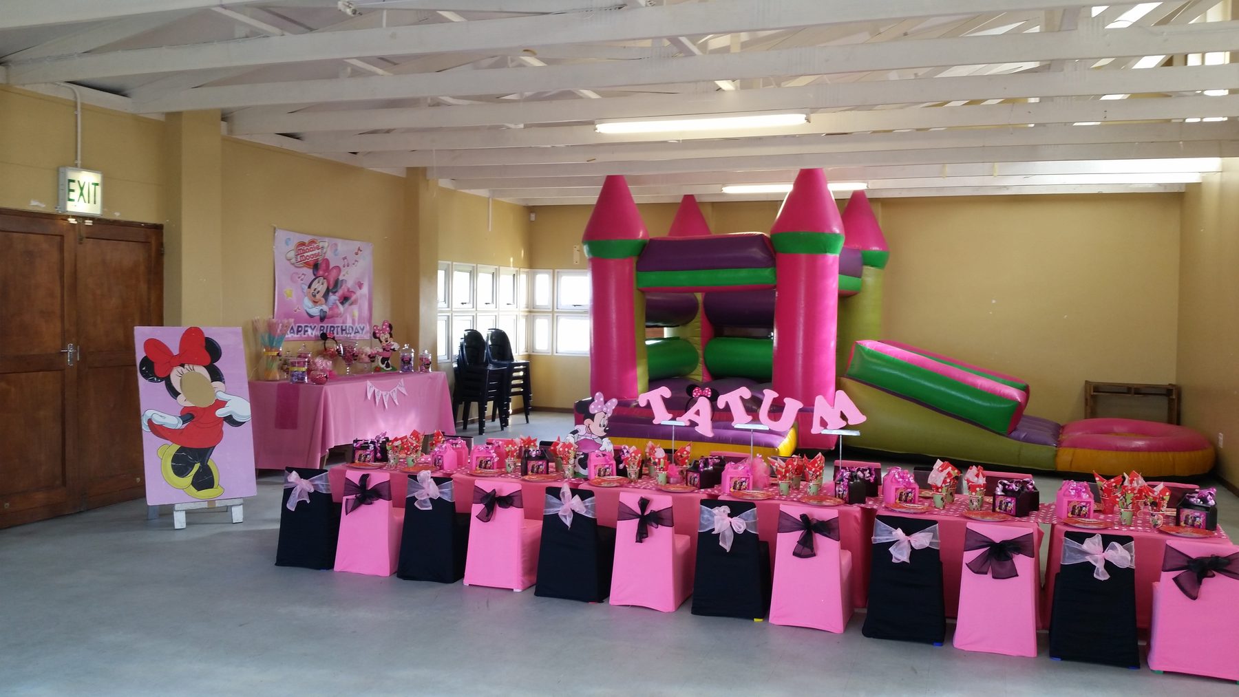 Kids Party World pink themed party setup with jumping castle