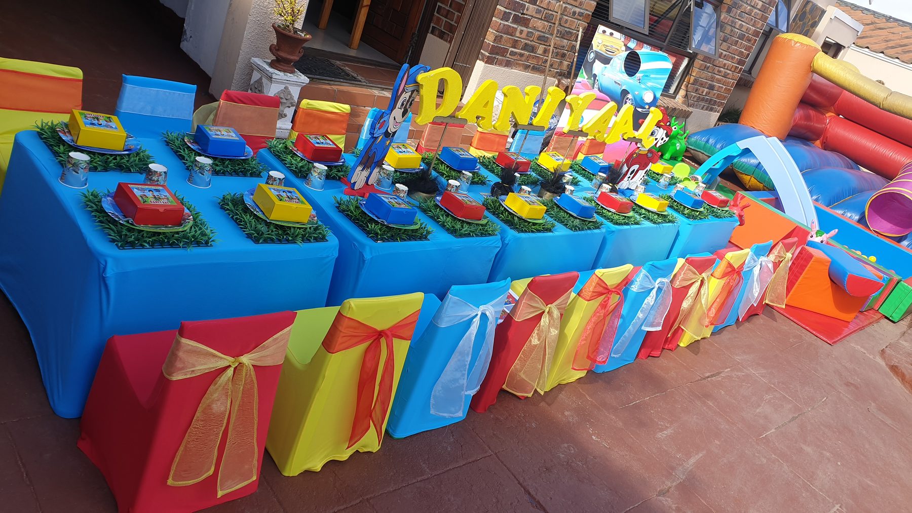 Colourful themed kids party table setup