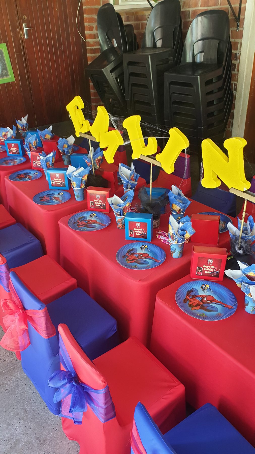 Red and blue superhero party table setup